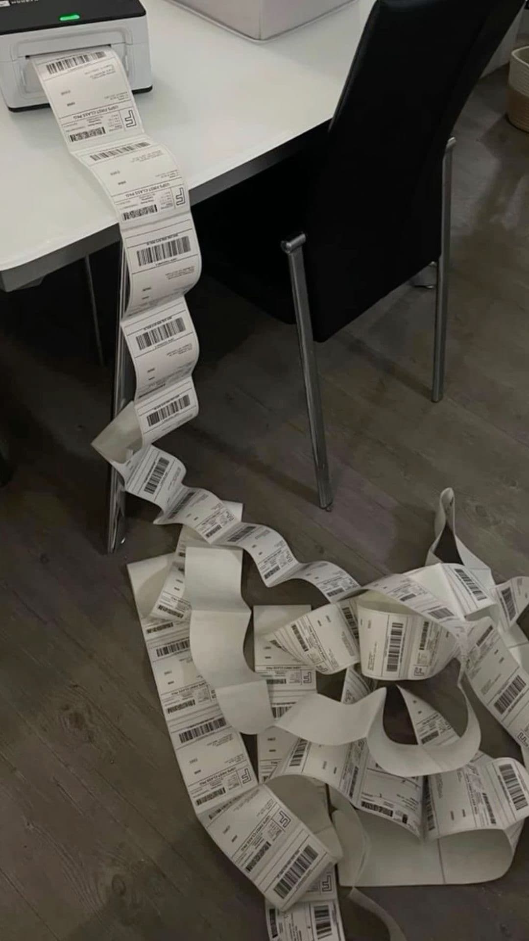 A pile of shipping labels spilling onto the floor